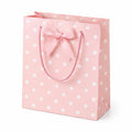 Borsa regalo 26 x 12 x 32 cm in carta rosa a pois con manici in corda e fiocco